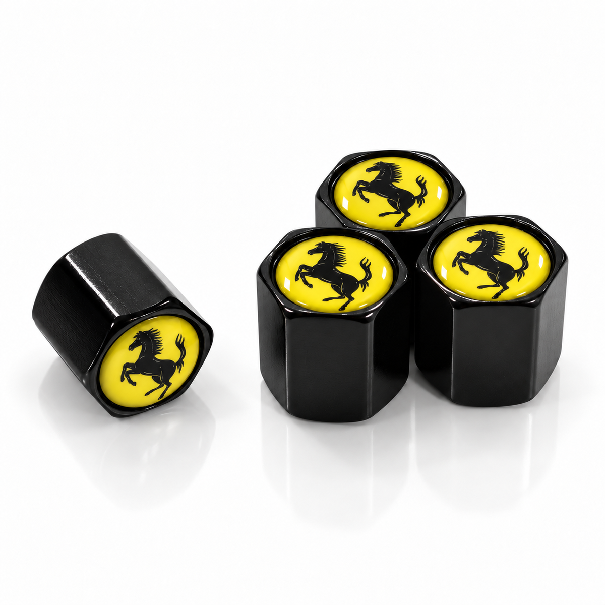 Set of four black hexagonal valve caps with yellow prancing horse badges