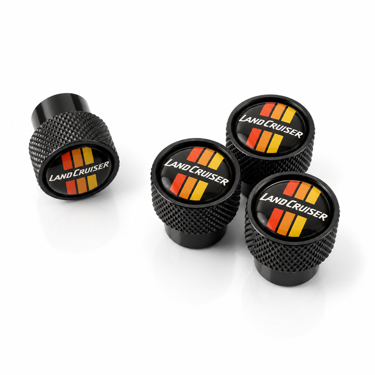 Black Toyota LandCruiser oversized valve caps with retro red orange and yellow stripes, set of 4