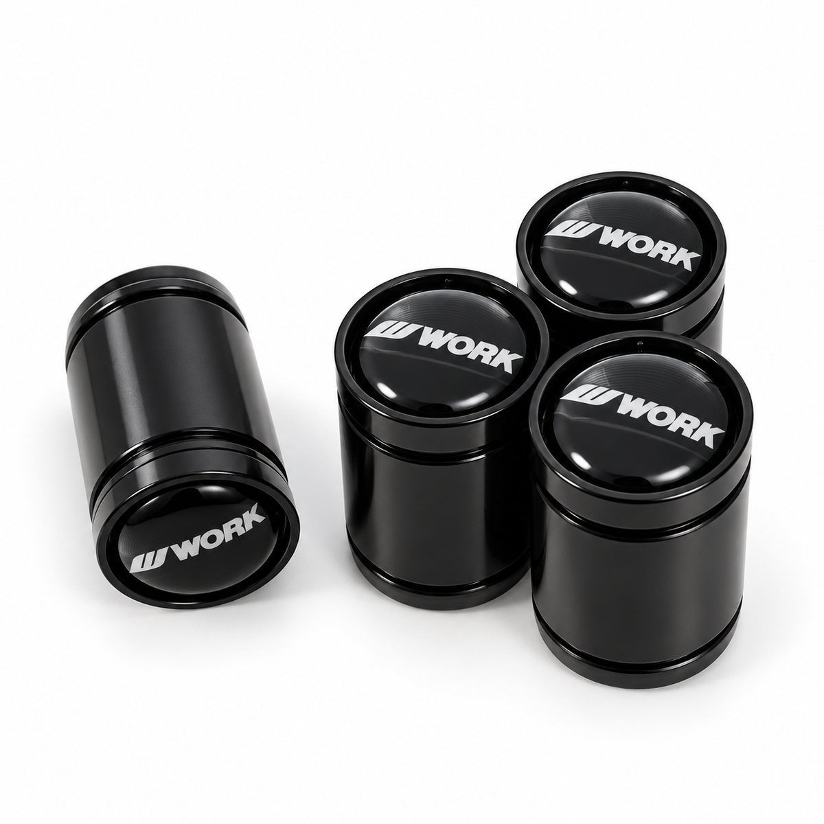 Four black WORK premium long valve caps